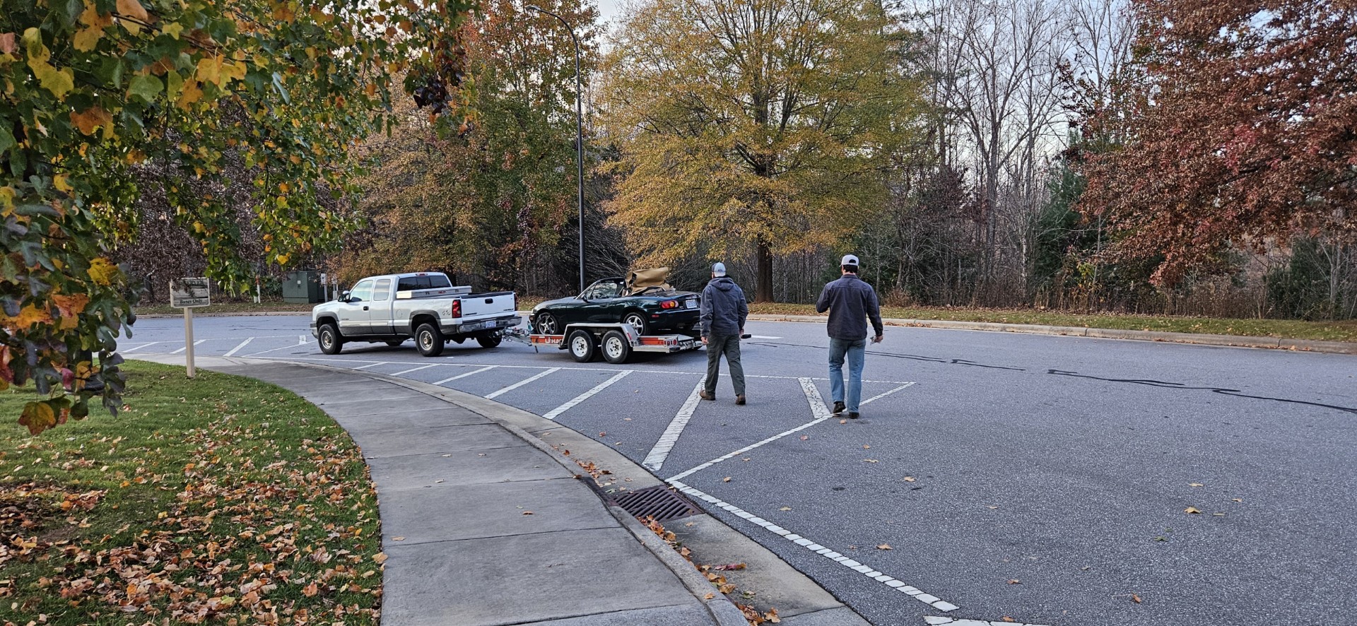 Charlie and Nolan walking toward trailer - teamwork in action